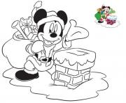 Coloriage mickey le pere noel pres de la chemine pour distribuer des cadeaux